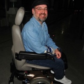 Scott in low-tech wheelchair