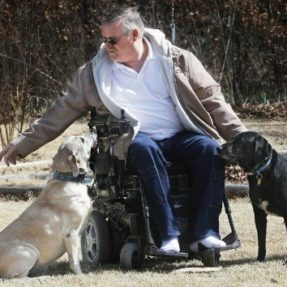 David Skaggs with three dogs