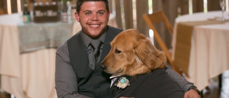 Kade Patterson Posing at a Formal Event with a Dog